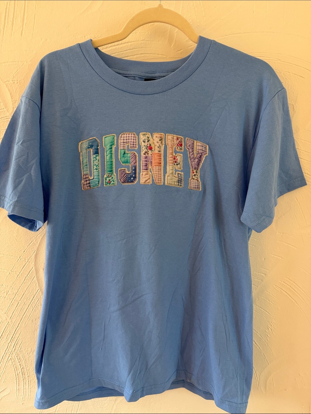 Disney Blue Tee with Multicolor Patchwork Logo